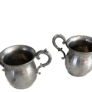 Vintage pewter sugar and creamer set.